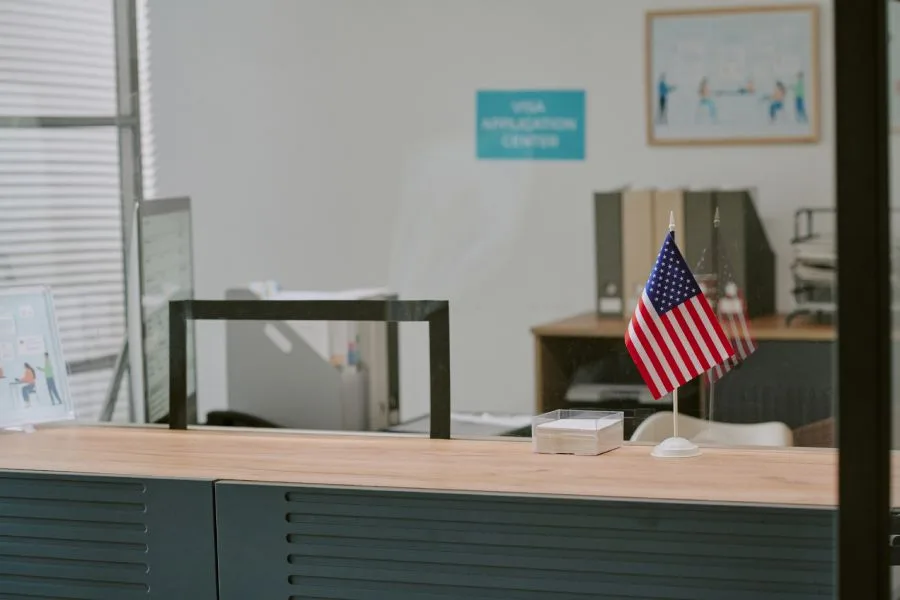 offices-and-workspaces Reception desk at a government office with a U.S. flag, cleaned by a reliable government cleaning company.